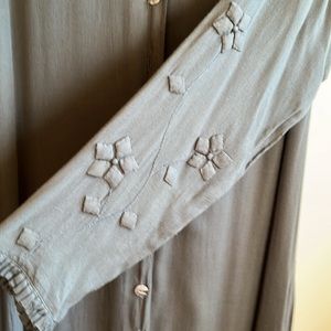 Midi dress in olive with a high low hem. Sleeve and hem detail.  100% rayon